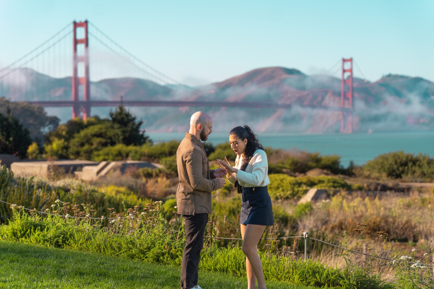 Alex and Abby reacting together during their Golden Gate Bridge proposal