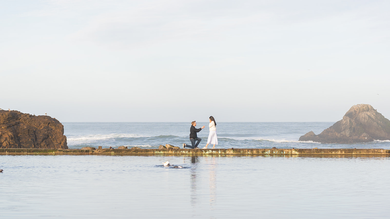 Surprise proposal photography at Sutro Baths in San Francisco