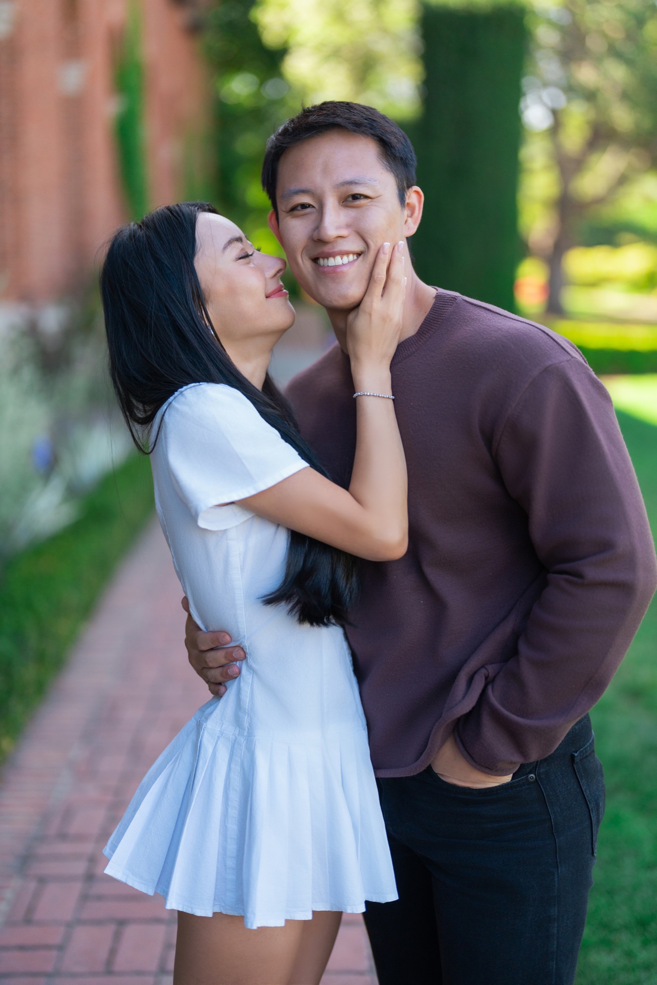 Alexandra kissing Ernest after their surprise proposal at Filoli
